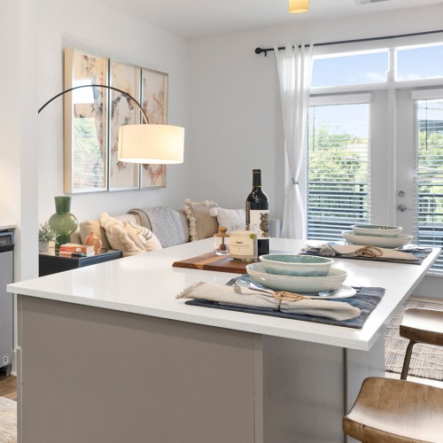 Beautiful kitchens with designer finishes a kitchen with an island and chairs