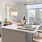 a kitchen with an island and chairs