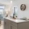 a kitchen with an island and chairs