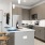a kitchen with grey cabinets and a large island