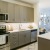 a kitchen with white cabinets