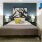 a bed with a large painting on the wall