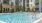 a swimming pool in front of a building