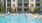 a swimming pool with lounge chairs