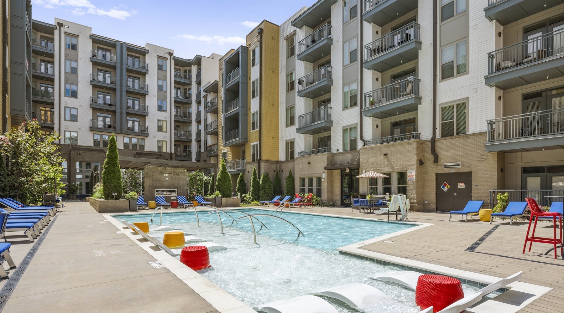 Swimming pool and exterior of Charlotte apartments at Bradham at New Bern.