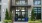 a building with a glass door and a sign on top