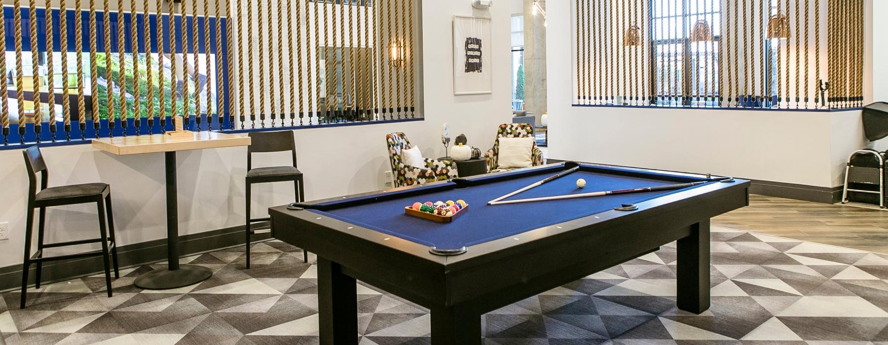 Pool table in the game room at Bradham at New Bern pet-friendly apartments in Charlotte