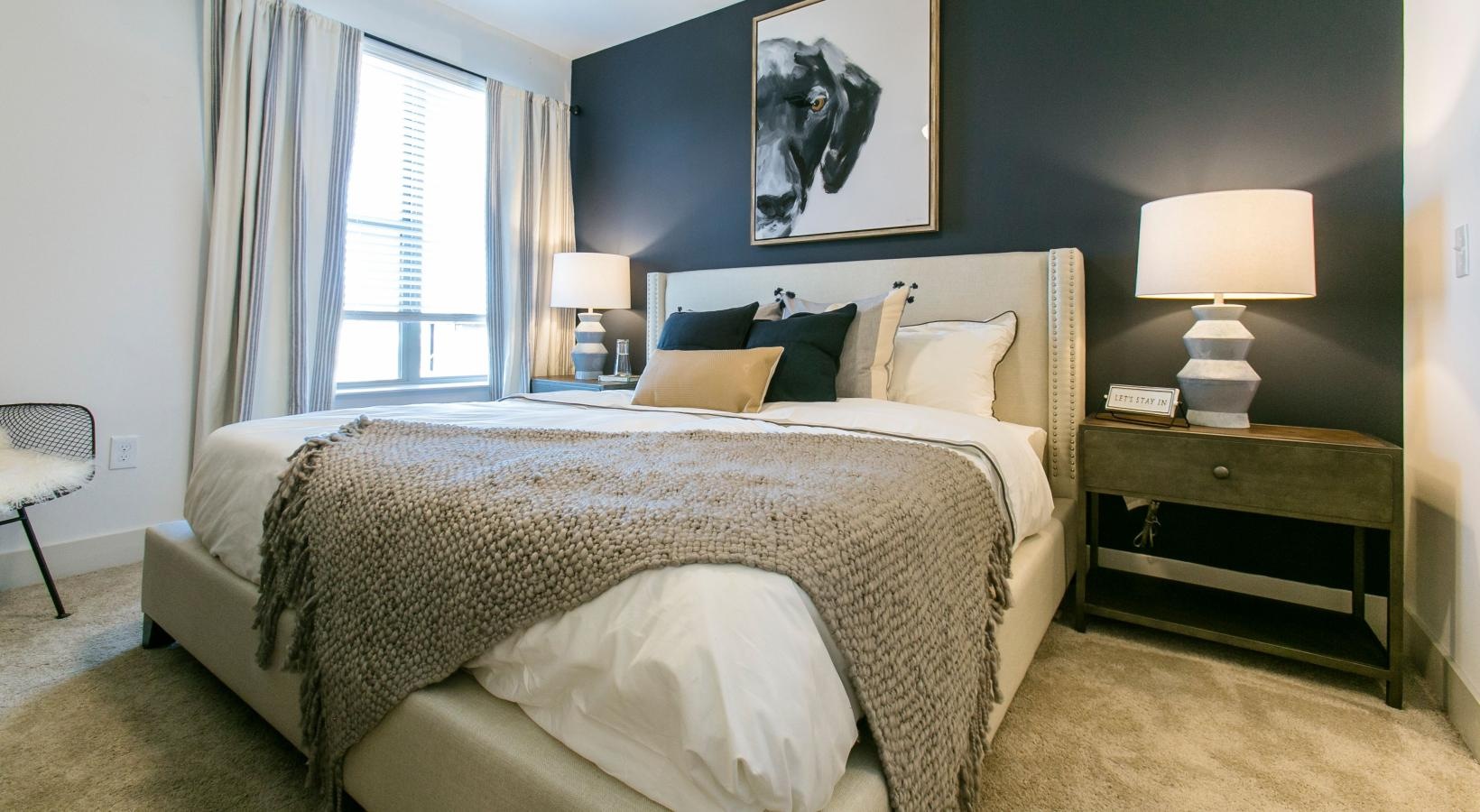 Relax and recharge in beautiful and spacious bedrooms a bedroom with a bed and lamps