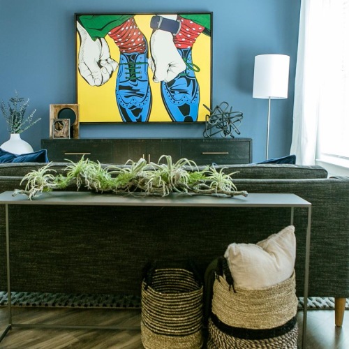 The essence of exceptional living a room with a table and a painting on the wall