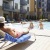 a group of people sitting around a pool