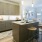 a kitchen with a bar stool and a microwave oven
